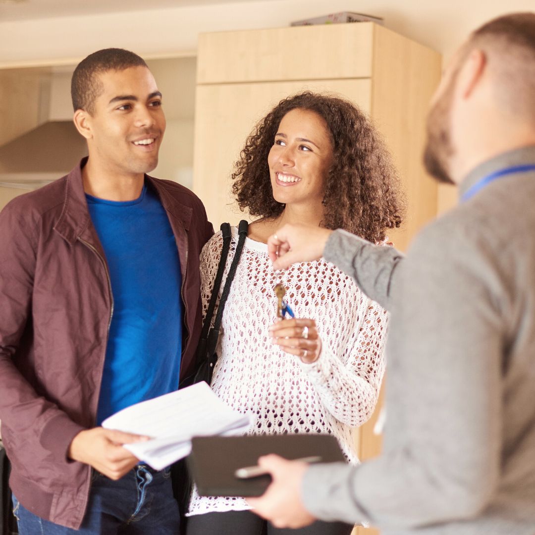 handing keys to new tenants