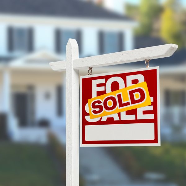 A house with a Sold sign out front